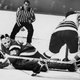 Mike Chernoff of the AHL Cleveland Barons scores against Providence Reds goalie Ross Brooks in a 1970 game.